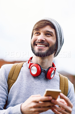 Buy stock photo Thinking, backpack and man with phone in city for travel, information and online navigation. Happy, male person and headphones with technology for outdoor journey, communication and tourism in London