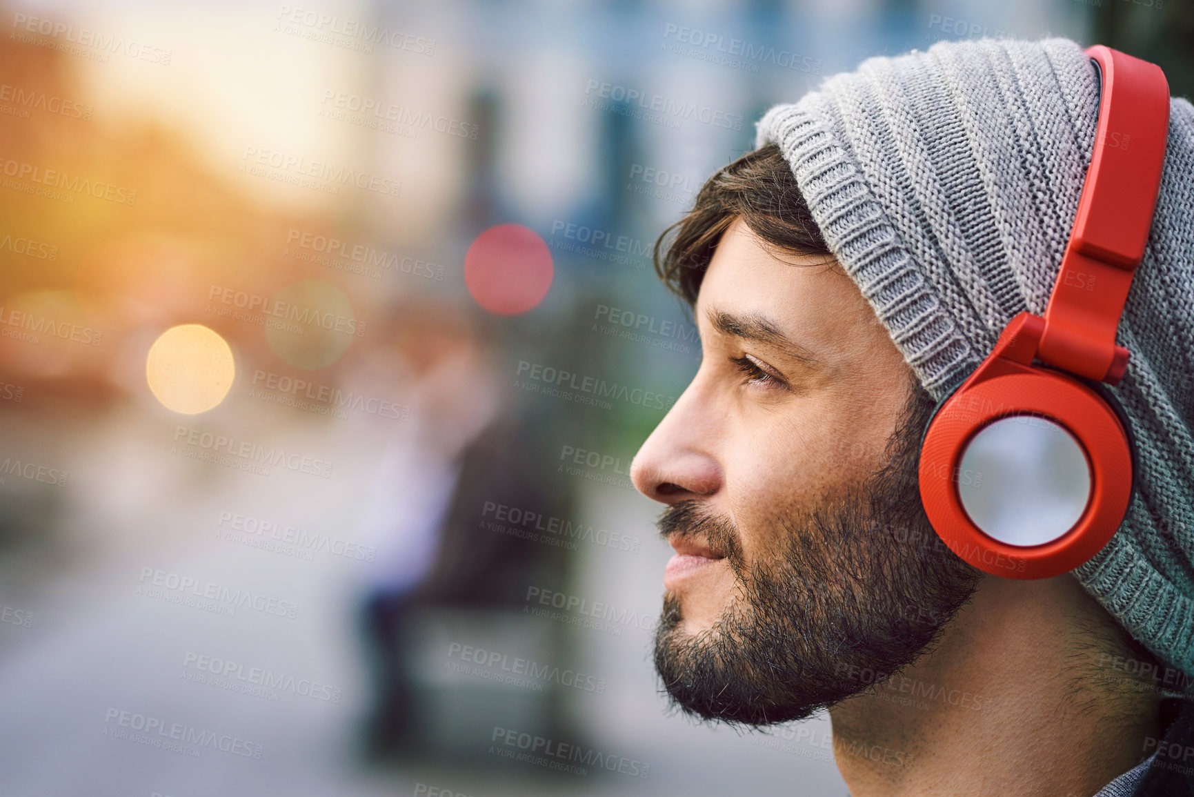 Buy stock photo Music, travel and profile of happy man with headphone in city for commute, streaming podcast or radio. Bokeh, mockup and person for morning journey, listening to playlist or song on internet in town