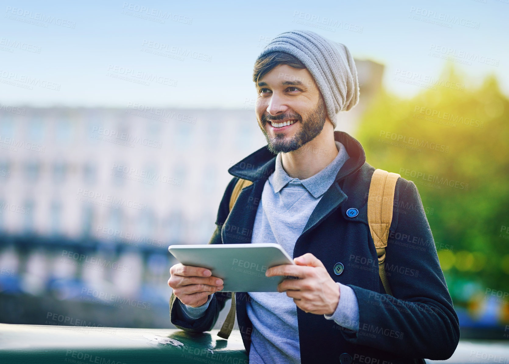 Buy stock photo Happy man, tourist and smile with tablet for social media, update and meme on internet. Comedy, thinking and male person outside with technology for video, communication and networking or traveling