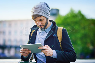 Buy stock photo Man, tourist and reading on tablet for social media, update and research on internet. Tourism, navigate and male person outside with technology for map, website and networking in city for traveling