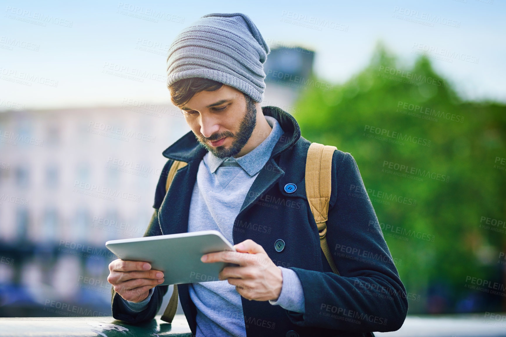 Buy stock photo Man, tourist and reading on tablet for social media, update and research on internet. Tourism, navigate and male person outside with technology for map, website and networking in city for traveling