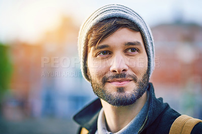 Buy stock photo Man, thinking and happy in city for tourism, sightseeing and travel with blurred background on holiday. Male person, idea and commute in urban for adventure, relax and trip with backpack on vacation