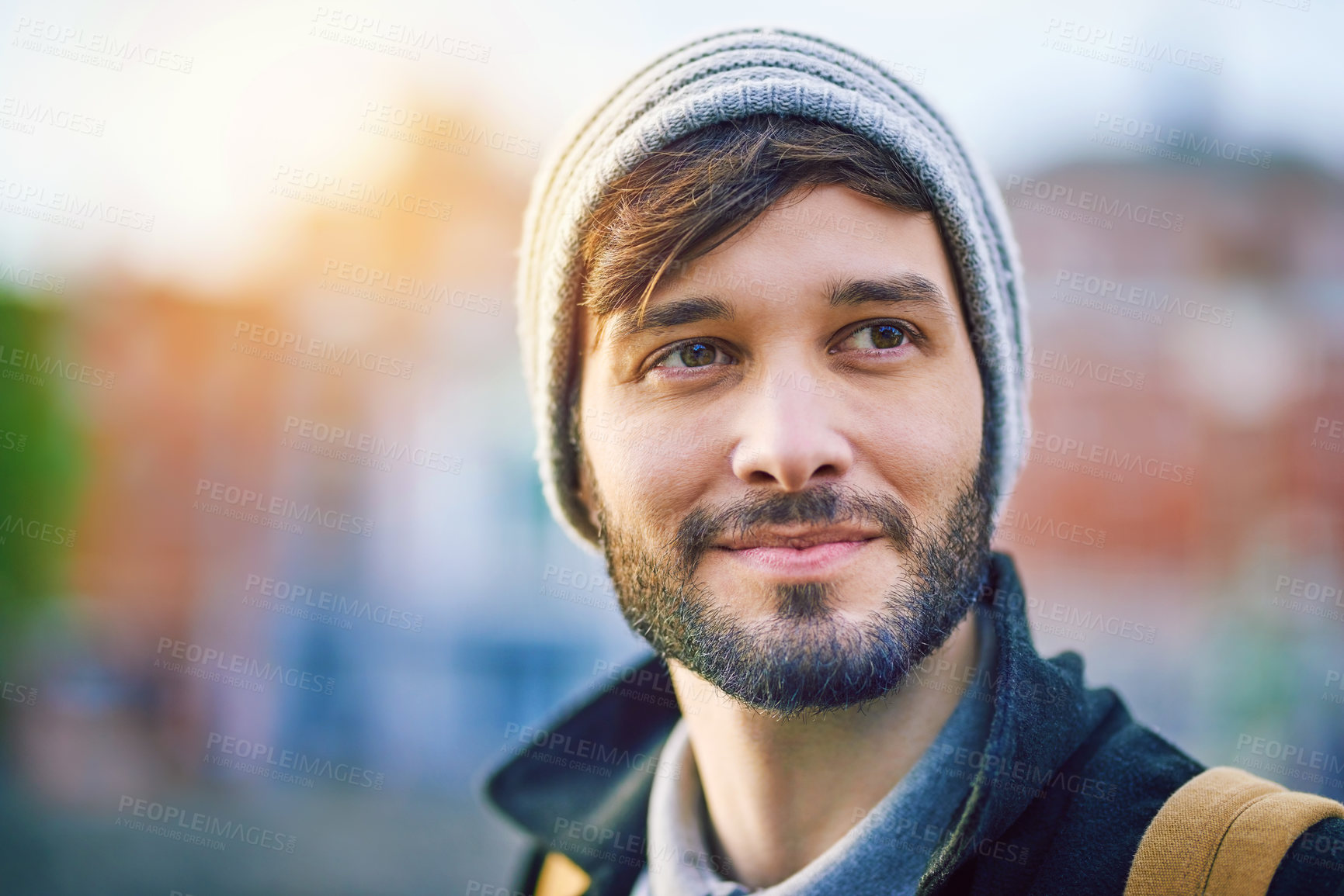 Buy stock photo Man, thinking and happy in city for tourism, sightseeing and travel with blurred background on holiday. Male person, idea and commute in urban for adventure, relax and trip with backpack on vacation