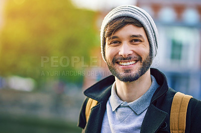 Buy stock photo Portrait of a confident young man out and about in the city