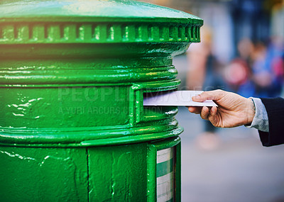 Buy stock photo Hands, letter and postbox with person in city, outdoor to send message via post office service closeup. Delivery, mail or paper and business employee with postal envelope on street of urban town