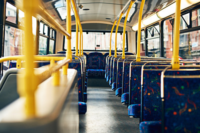 Buy stock photo Inside of an empty bus, rows of seats in an interior of modern public transport. Neatly arranged chairs for the transportation of many passengers, vacant and ready for a cheap, local city trip