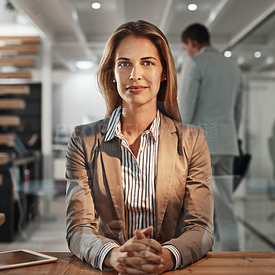 Buy stock photo Cropped portrait of an attractive mature businesswoman sitting in her office