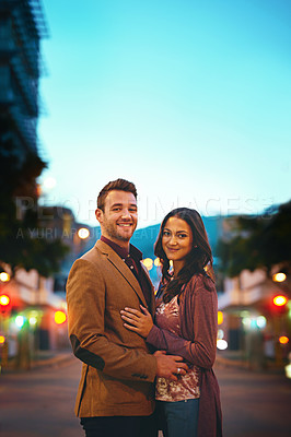 Buy stock photo Street, portrait and couple in night, date and hug or embrace for romance, bokeh and New York. Weekend, man and woman in dark on road, anniversary and smile in city, happiness and relationship