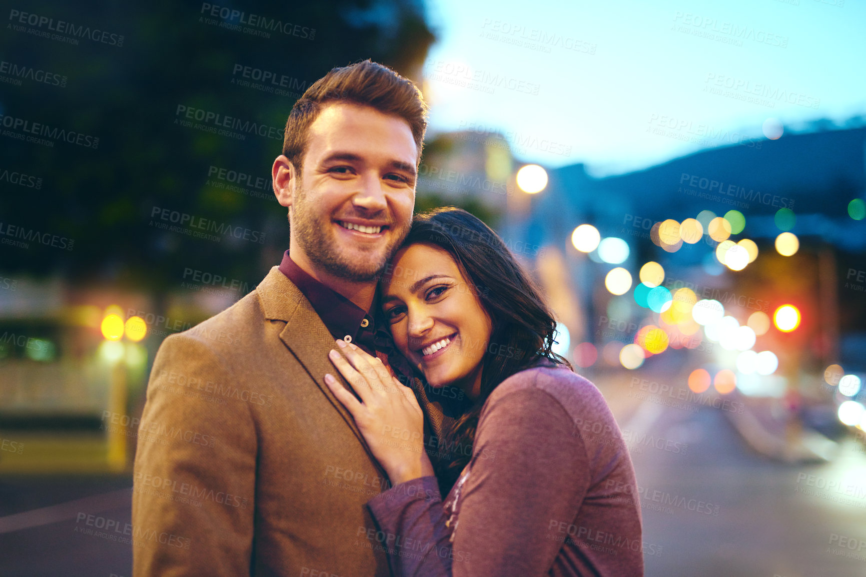 Buy stock photo Portrait, man and woman in night, hug or embrace, date and anniversary together. Outdoor, road and couple, care and female person in relationship with partner, love and romance in New York city