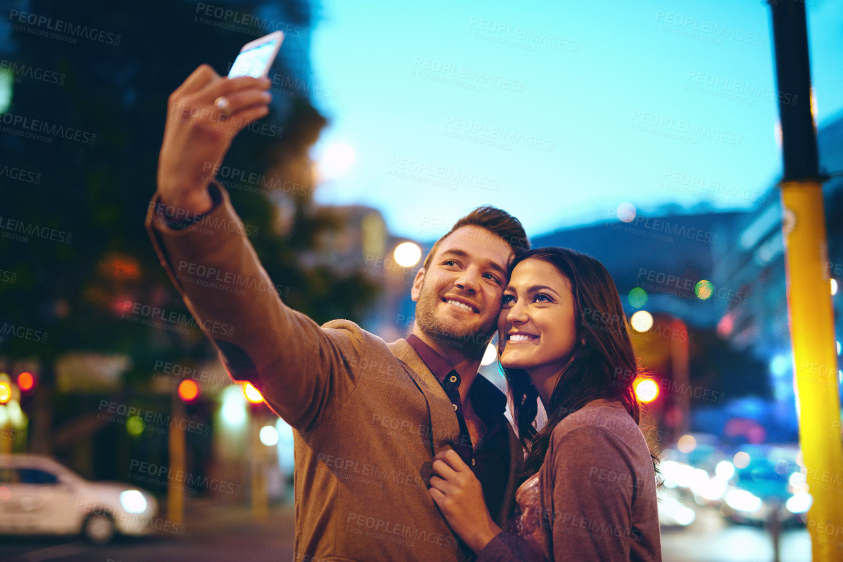 Buy stock photo Selfie, couple and city with love at night outside on honeymoon for marriage with happiness. Romantic, relationship and profile picture for social media with smile or hugging in New York with embrace