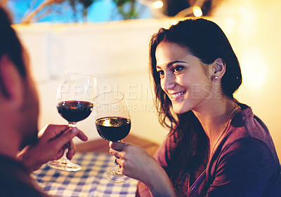 Buy stock photo High angle shot of an affectionate young couple having a romantic dinner in a restaurant