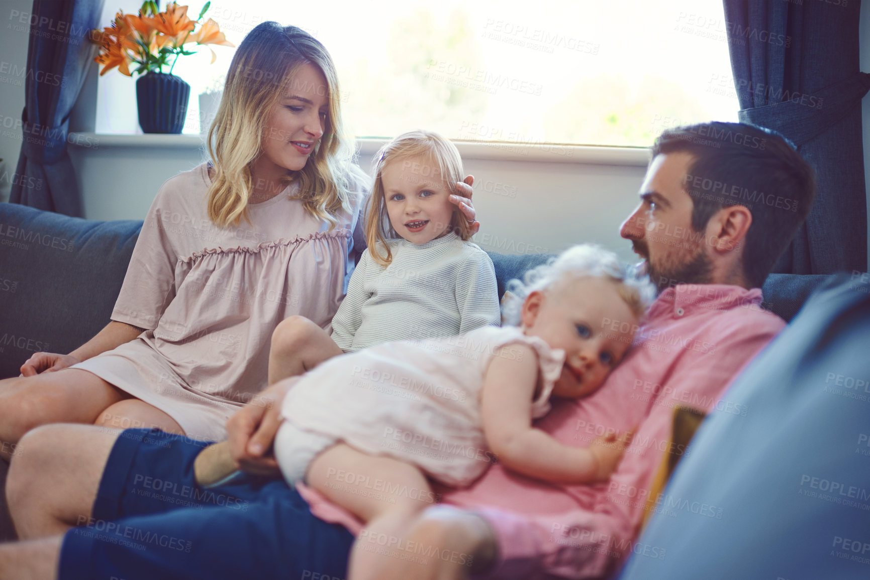 Buy stock photo Smile, bonding and care with family on sofa of lounge for happiness, playful and relax. Calm, love and support with parents and children in living room of home for trust, growth and comfort together