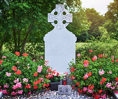 Buy stock photo Celtic cross, tombstone and graveyard with flowers for memory, peace or mockup space outdoor. Christian crucifix, blank gravestone or cemetery for catholic history, death or holy site for remembrance