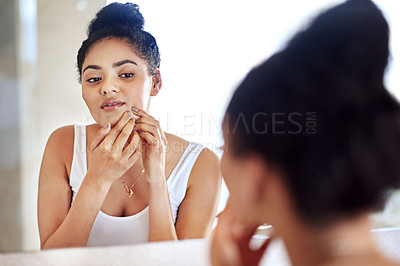 Buy stock photo Morning, mirror and woman popping pimple on face with hands, dirt or scar on skin in home. Dermatology, facial wellness and girl in bathroom to squeeze acne, checking reflection or skincare routine