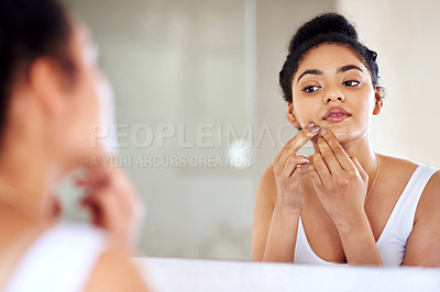 Buy stock photo Skincare, woman and mirror to pop pimple on face with hands, dirt or scar on skin in home. Dermatology, facial wellness and girl in bathroom to squeeze acne, checking reflection or morning routine