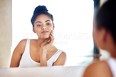 Buy stock photo Skincare, beauty and woman at mirror in bathroom for dermatology, wellness and morning routine for hygiene in home. Face, reflection and girl touch skin with cosmetics, makeup and cleaning for health