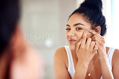 Buy stock photo Skincare, mirror and woman popping acne on face with hands, dirt or scar on skin in home. Dermatology, facial wellness and girl in bathroom to squeeze pimple, checking reflection or morning routine