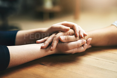 Buy stock photo Holding hands, comfort and support of friends, care and empathy together on table in home mockup. Kindness, love and women hold hand for hope, trust or prayer, solidarity or compassion, help or unity