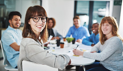 Buy stock photo Portrait of a young designer sitting in the boardroom with her colleagues