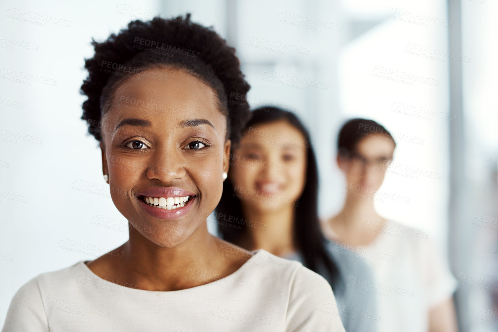 Buy stock photo Portrait of a diverse team of professionals standing together in an office