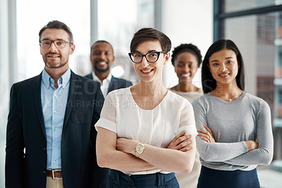Buy stock photo Portrait of a diverse team of professionals standing together in an office