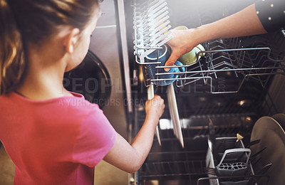 Buy stock photo Dishwasher, mother and daughter with hands cleaning in kitchen together with help, learning or teaching. House, mom and girl in home washing dishes in machine with love, support and morning chores