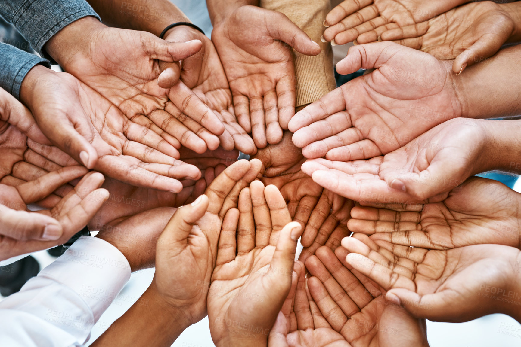 Buy stock photo Hands, palm and diversity of people in circle of charity, support and community together from above. Closeup, helping hand and teamwork for crowdfunding, donation and society of peace, unity and care