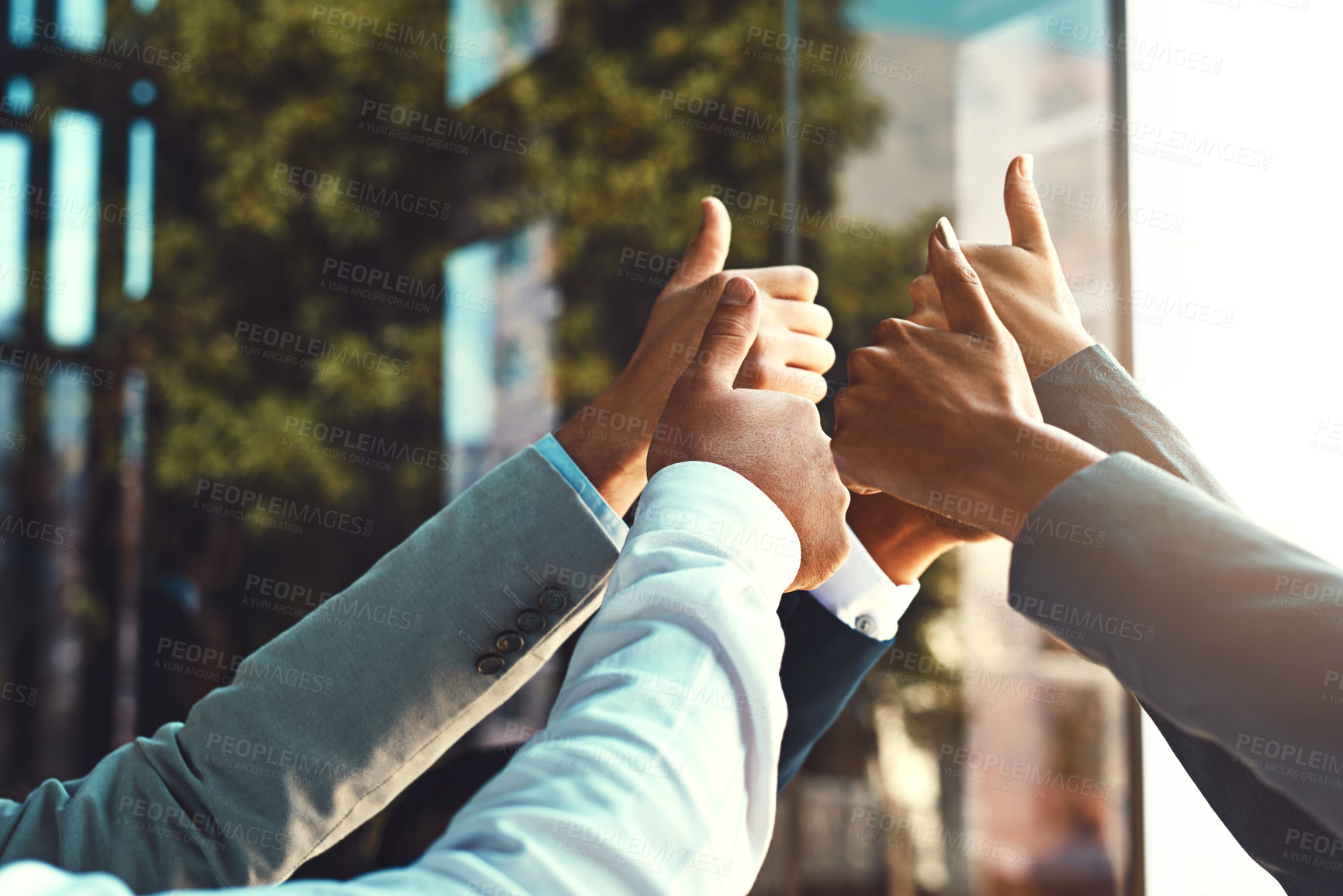Buy stock photo Diversity, business and hands of team thumbs up in office building for unity with support, trust and yes for collaboration. People, huddle and gesture together for success for partnership and goals.