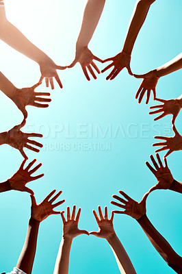 Buy stock photo Community, support with hands in air and in blue sky outdoors for unity. Diversity or collaboration, sunlight and group of people with their hand in a circle for solidarity or trust with lens flare 