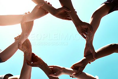 Buy stock photo Arms, unity and support with people against a sky background outdoor for motivation, teamwork or unity. Diversity, collaboration and partnership with a group of friends standing in a circle together