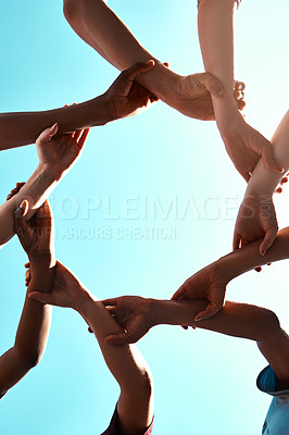 Buy stock photo Hands, link and circle with team and blue sky with low angle, solidarity and trust with arm chain and people together. Teamwork, motivation and connection with group collaboration and community