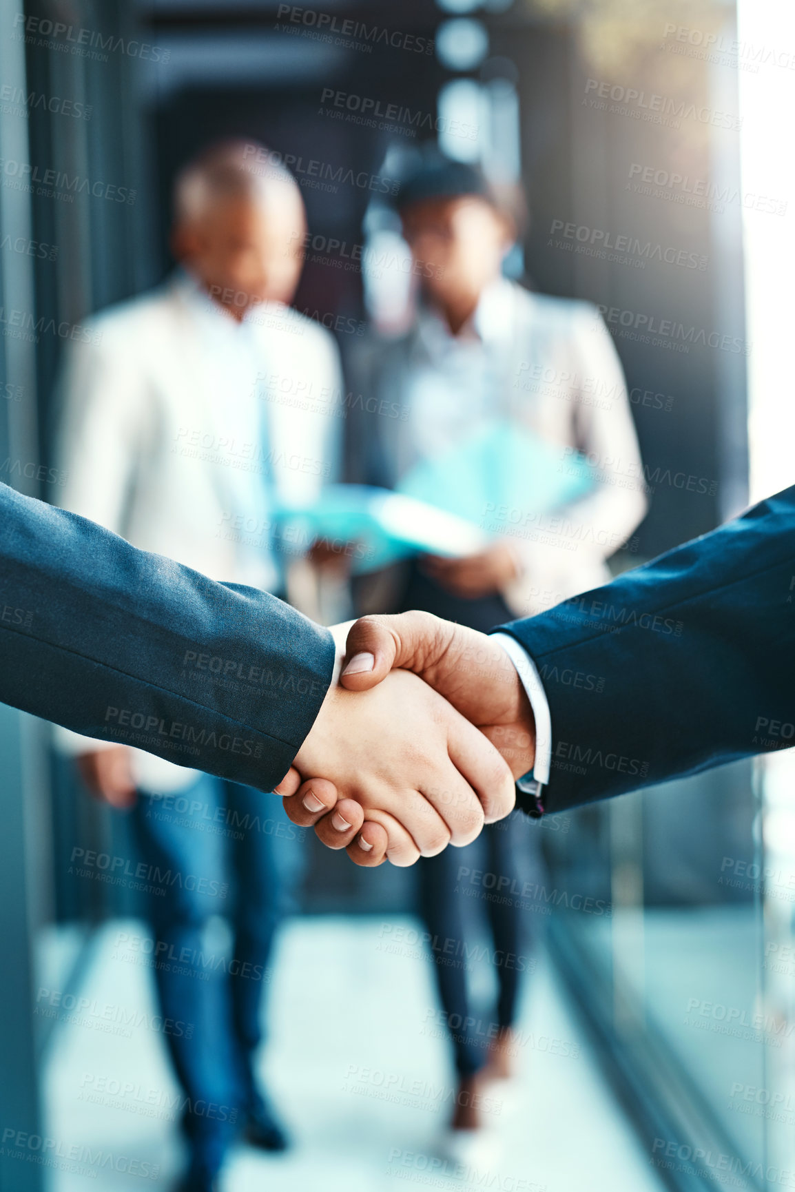 Buy stock photo Cropped shot of two businesspeople shaking hands