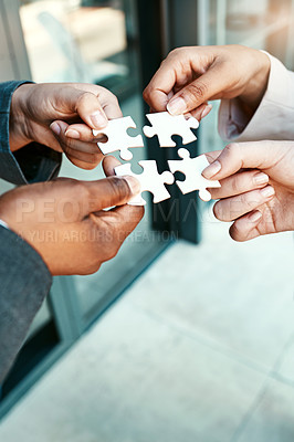 Buy stock photo Closeup, hands and puzzle with collaboration, group and teamwork with partnership, planning and brainstorming. Zoom, staff and team with ideas, jigsaw pieces and cooperation with support and solution