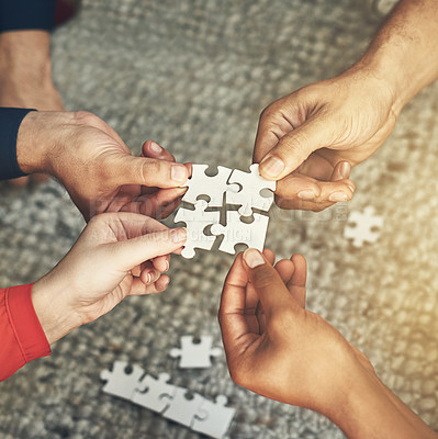 Buy stock photo Hands, team and puzzle for teamwork or collaboration of business people for challenge or project. Above group of employees or friends building jigsaw together for solution, synergy or problem solving