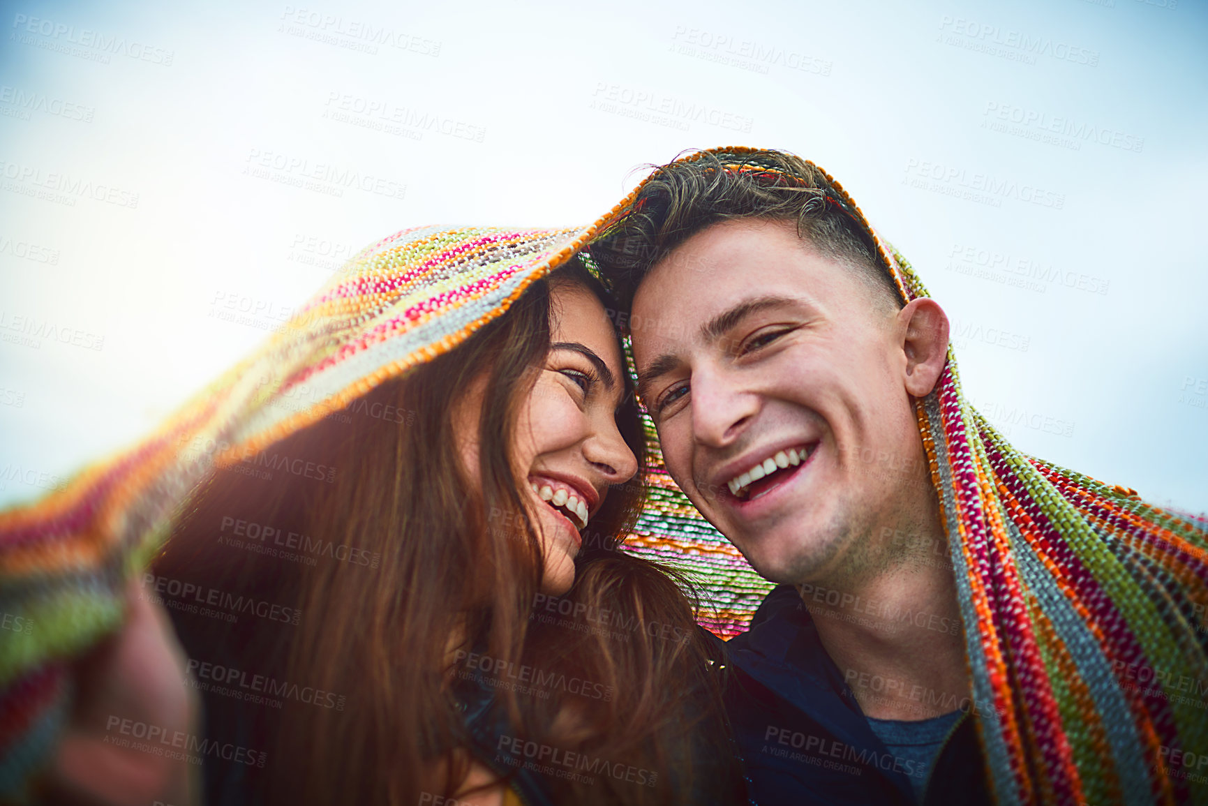 Buy stock photo Couple, relax and smile with blanket outdoor for winter date, adventure and bonding with mockup space. Happy people, romance and blue sky with travel for connection, affection and love relationship