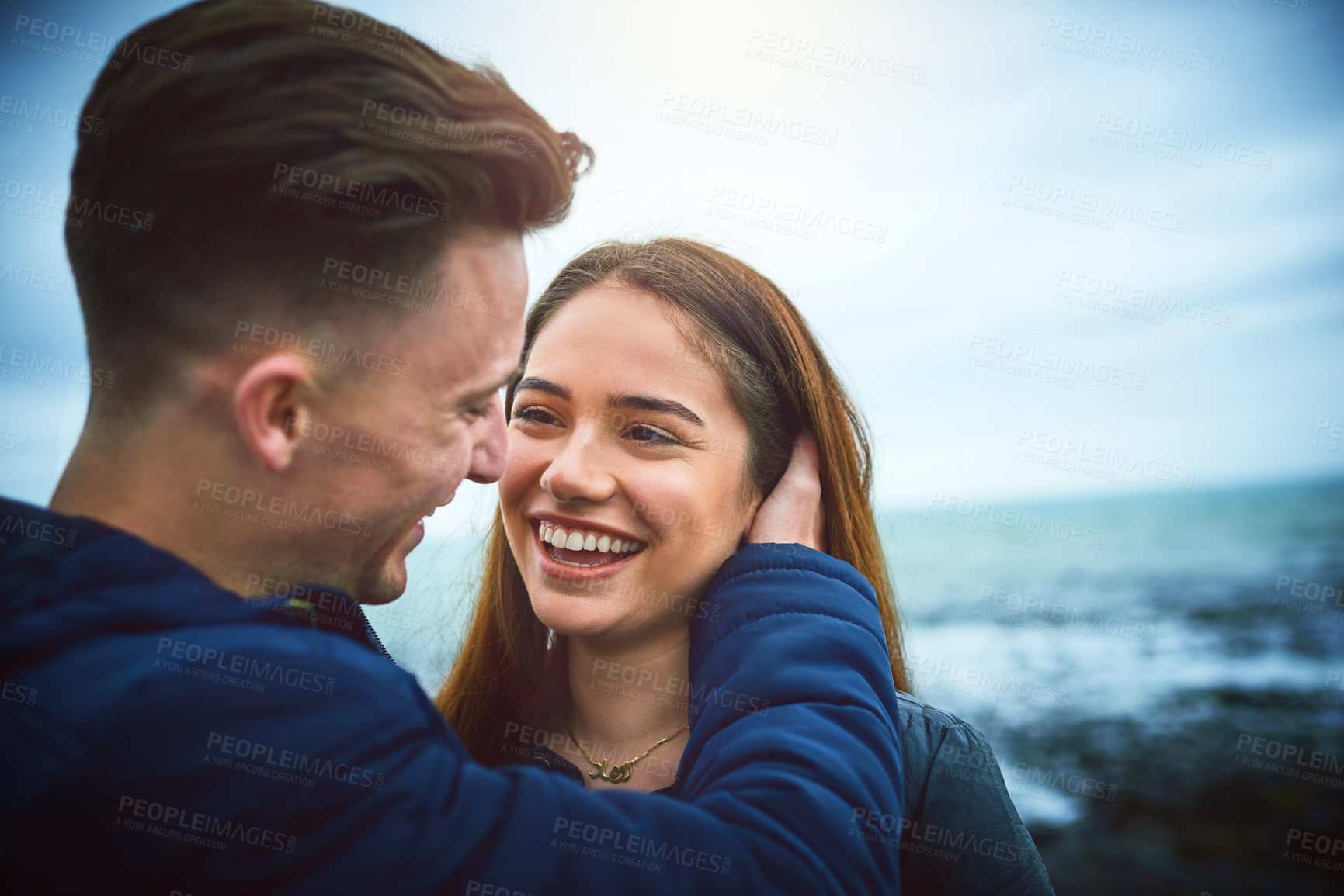 Buy stock photo Couple, happy and beach for love, bonding and relax with relationship, romance and outdoor date. Man, woman and ocean outside for care, support and connection with partner, smile and weekend together