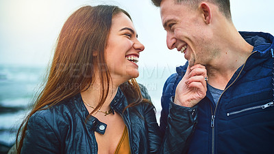 Buy stock photo Couple, happy and connection at beach for love, bonding and relax with relationship, romance and date. Man, woman and smile by ocean for care, support and laugh with partner, fun and weekend together