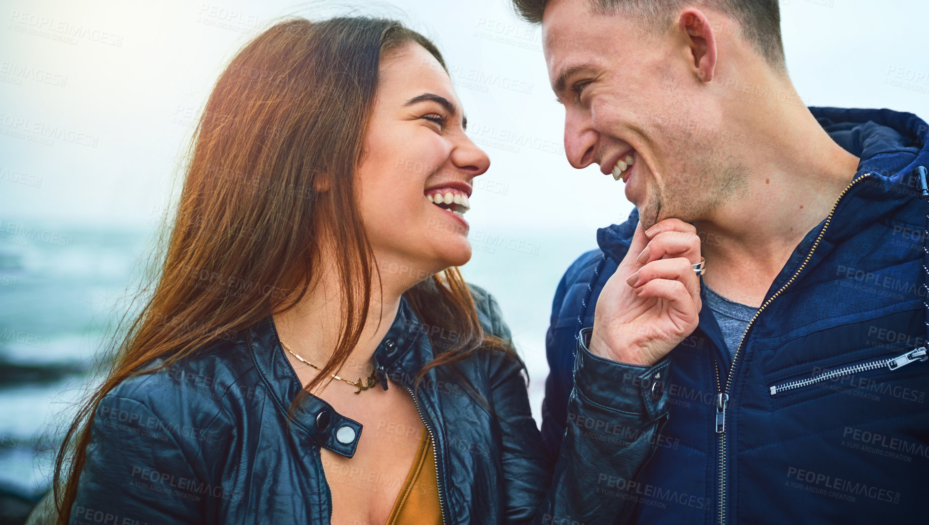 Buy stock photo Couple, happy and connection at beach for love, bonding and relax with relationship, romance and date. Man, woman and smile by ocean for care, support and laugh with partner, fun and weekend together