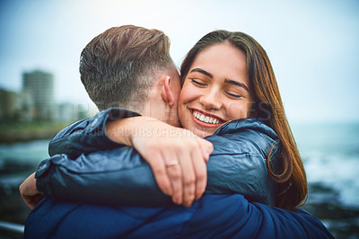 Buy stock photo Happy, couple and hug outdoor by sea with love, romance and date with smile and relax. Vacation, care and woman with embrace, bonding and break together on pier in Chicago on winter holiday by ocean