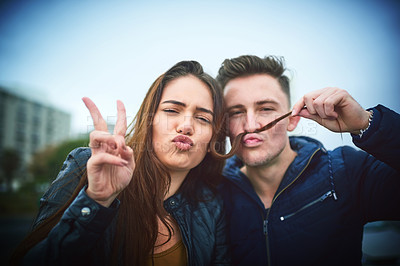 Buy stock photo Portrait, playful and couple with peace sign outdoor for funny memory, hair moustache and bonding together. Woman, man and goofy with hand gesture for love, partnership and care support of city date