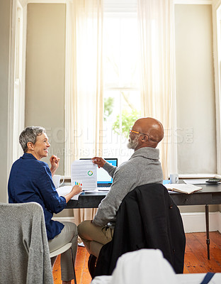Buy stock photo Cropped shot of a senior couple working on their finances at home