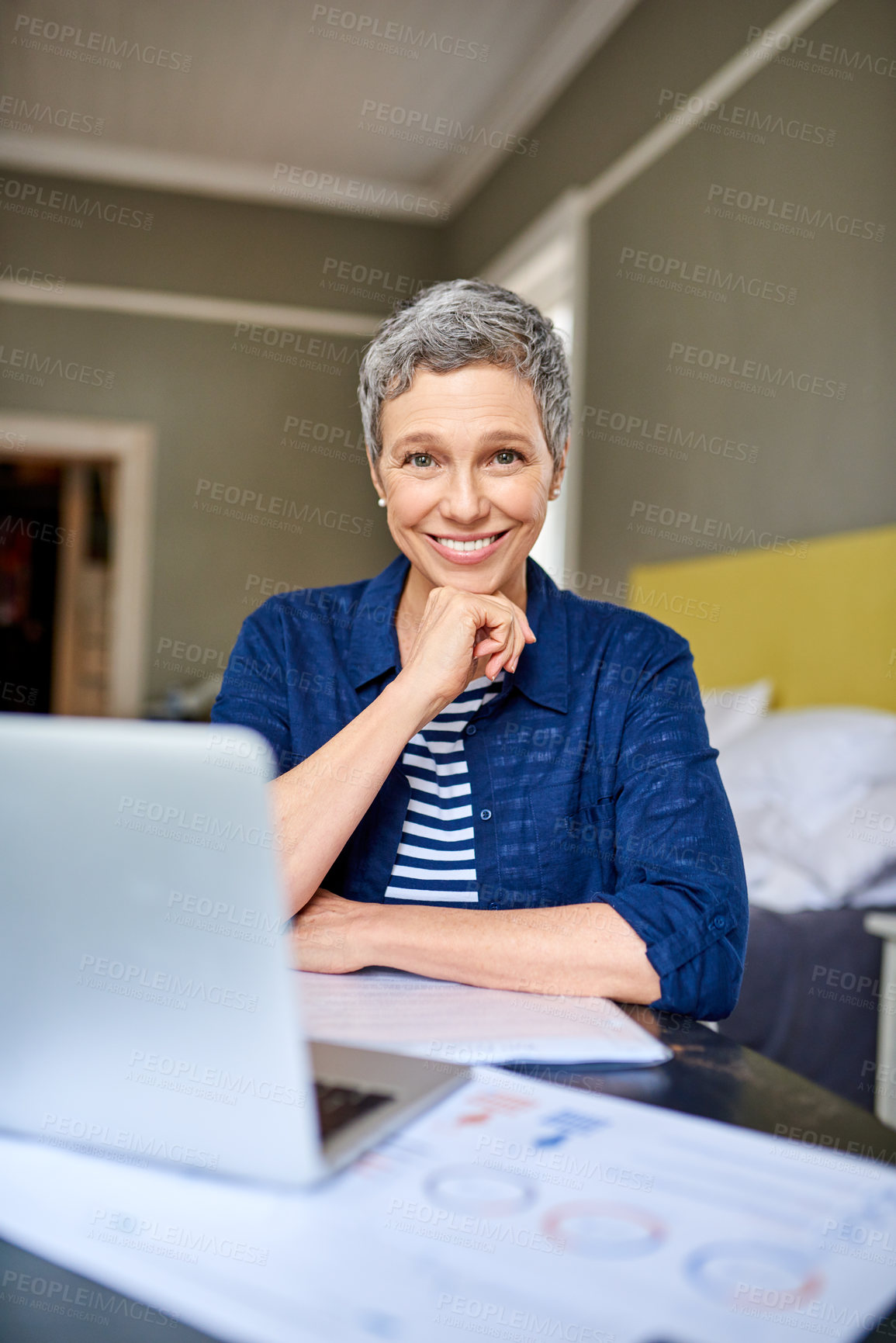 Buy stock photo Cropped portrait of a senior woman looking thoughtful while working on her finances at home