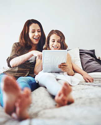 Buy stock photo Funny, mother and child on tablet in bed at home together for game, relax and family streaming comedy movie. Happy girl, mom and technology in bedroom for meme, laughing or reading joke on app online