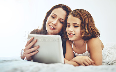 Buy stock photo Smile, mother and child on tablet in bedroom at home together for game, relax and family streaming movie. Happy girl, mom and technology in bed for learning, education or reading ebook on app online