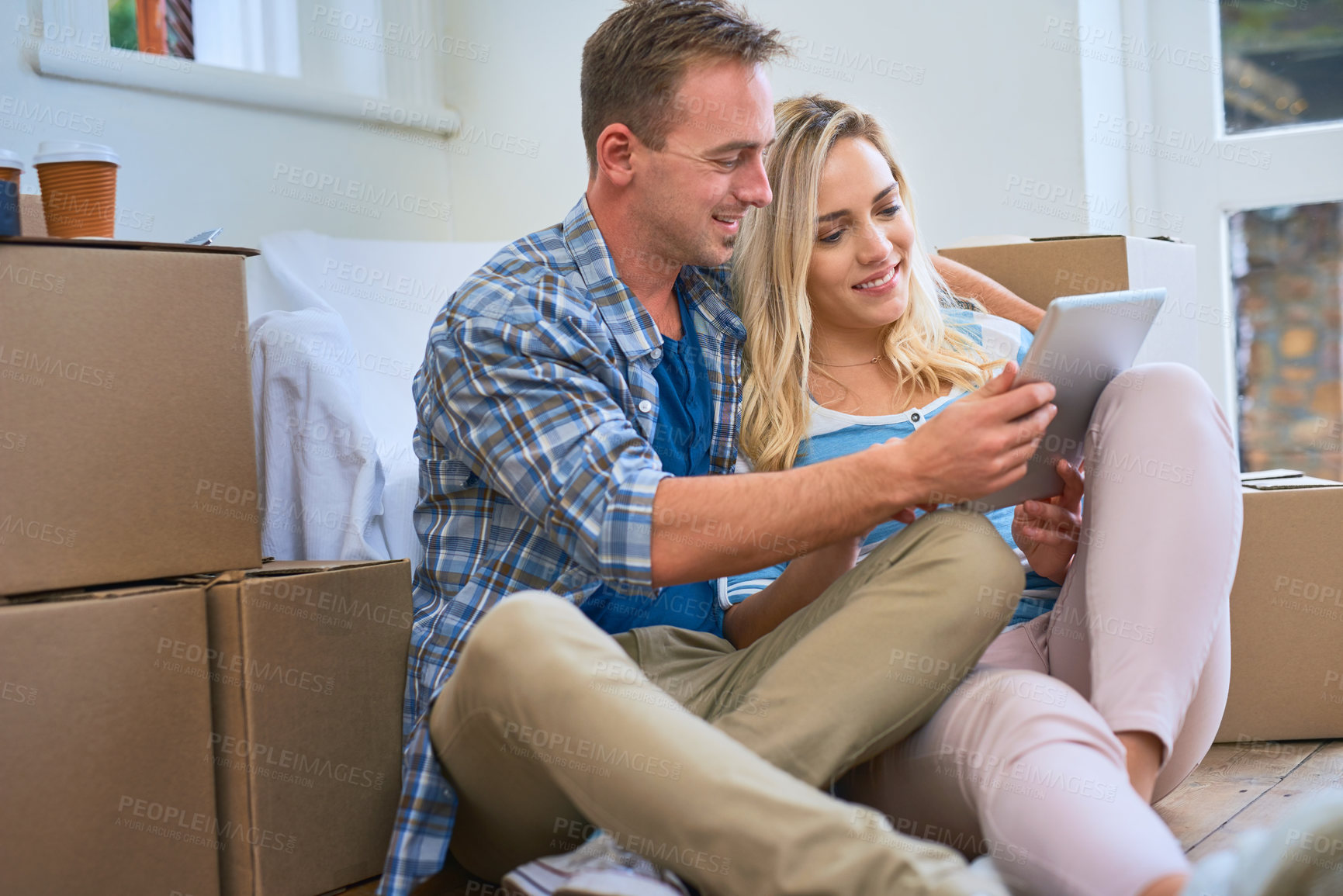 Buy stock photo New house, box and couple on floor with tablet for property, mortgage purchase and home investment. Homeowner, real estate and man and woman on digital tech for interior design, planning and website