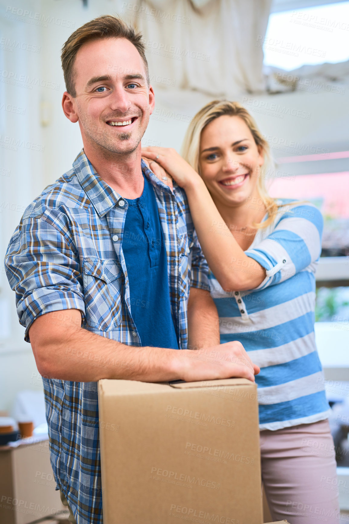 Buy stock photo Portrait, couple and loan for home, box and man in living room, happy and mortgage for real estate in apartment. Woman, new house and moving with packages, investment and smile for property in USA