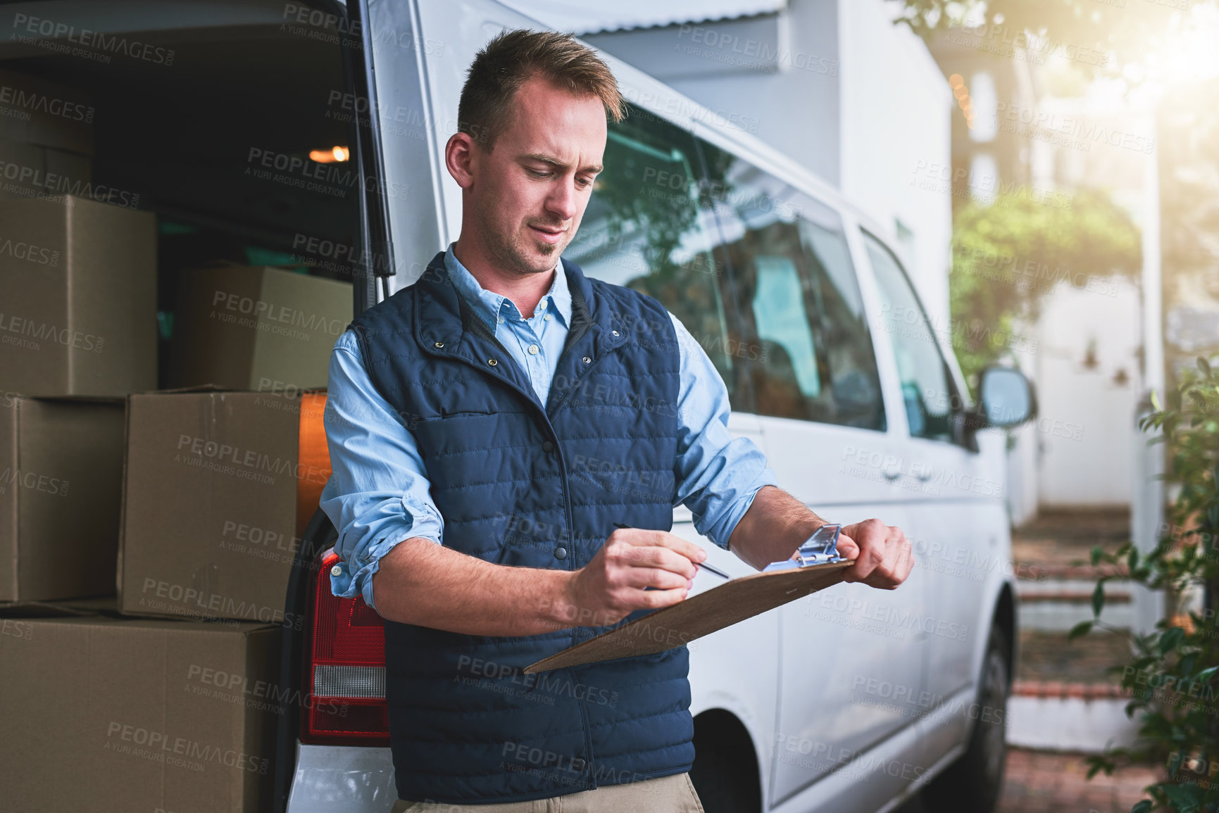 Buy stock photo Documents, delivery and a courier man with his van, checking a clipboard for an order or address. Logistics, ecommerce and supply chain with a male driver reading an inventory checklist for shipping
