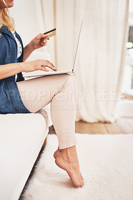 Buy stock photo Closeup shot of a woman making a credit card payment on a laptop at home