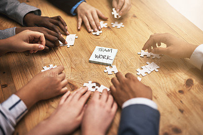 Buy stock photo Teamwork, puzzle and hands of business people in collaboration in a meeting together planning strategy at work. Circle, professional and group in a table with synergy as a workforce for innovation