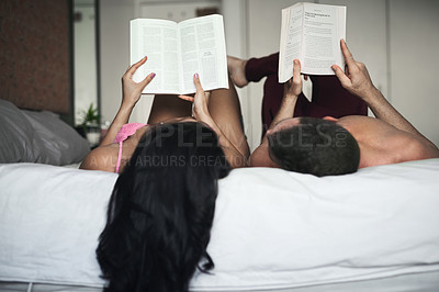 Buy stock photo Couple, reading book and bonding in bedroom on weekend for rest, relax and break as partners in home. Woman, man and hobby for sharing, together and relationship with comfort, care and love in house